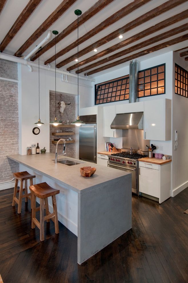 Concrete Countertop Solutions for a Industrial Kitchen with a Exposed Brick and Reiko Feng Shui Interior Design   Loft Renovation by Reiko Feng Shui Design