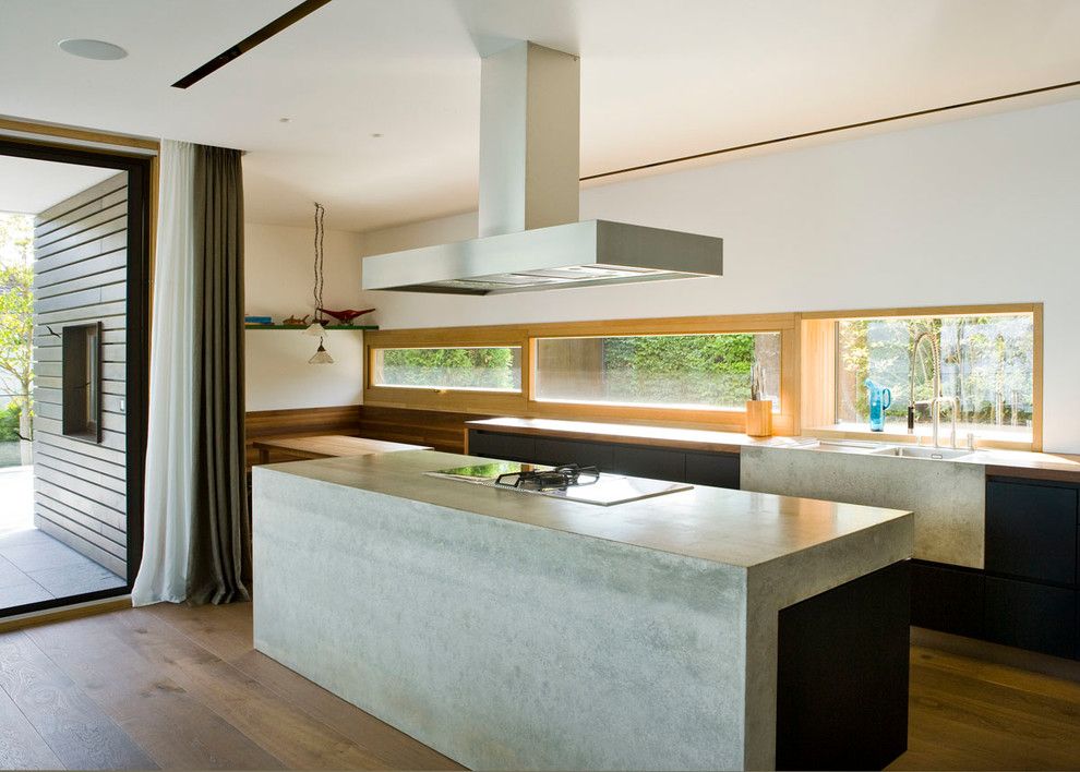 Concrete vs Asphalt for a Contemporary Kitchen with a Eiche and Küche Beton by Wiedemann Werkstätten