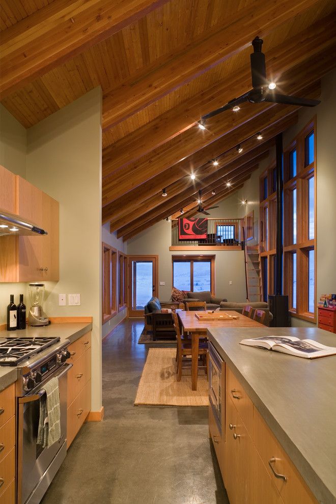 Concrete vs Asphalt for a Contemporary Kitchen with a Wood Ceiling Beams and Contemporary Kitchen by Lawrencearchitecture.com