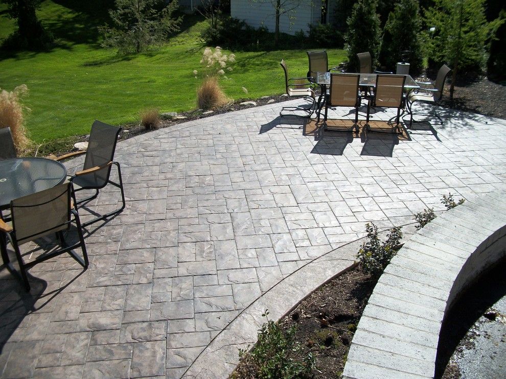 Concrete vs Asphalt for a Traditional Patio with a Stamped Concrete Patio and Ashler Slate Stamped Concrete Patio by Fordson Concrete