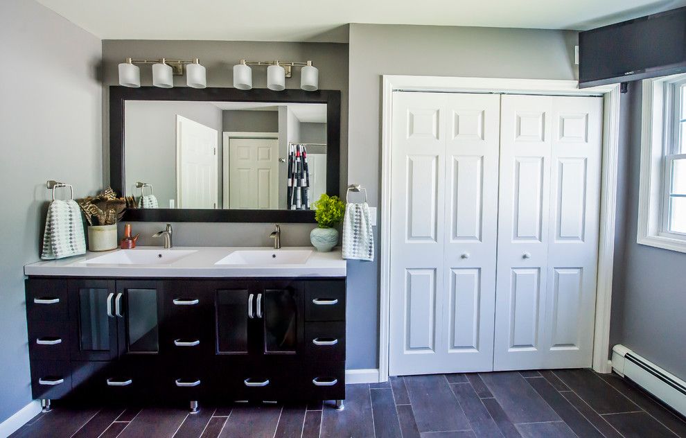 Conestoga Cabinets for a Modern Bathroom with a His and Hers Sinks and Troy Residence by Bespoke Decor