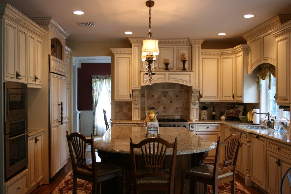 Conestoga Cabinets for a Traditional Kitchen with a Breakfast Bar and English Country Kitchen by Judy