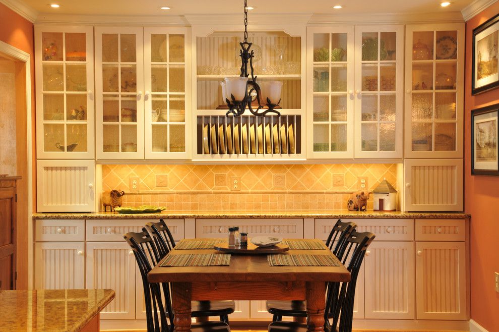 Conestoga Cabinets for a Traditional Kitchen with a Wood Cabinets and Dining Room Custom Installation by Julie Fifield