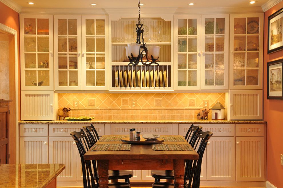 Conestoga Cabinets for a Traditional Kitchen with a Wood Cabinets and Dining Room Custom Installation by Julie Fifield