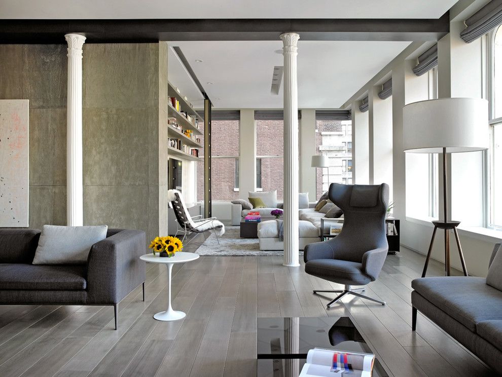 Corinthian Columns for a Contemporary Living Room with a Gray Couch and Bond Street Loft by Axis Mundi