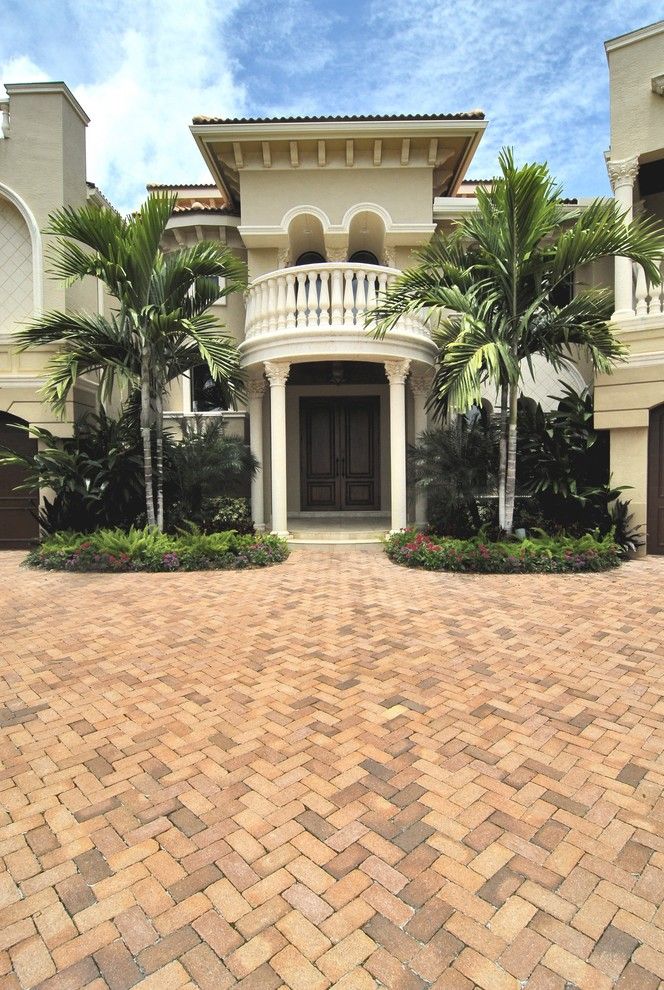 Corinthian Columns for a Mediterranean Exterior with a Beige Stucco Exterior and Intracoastal Images by Gregory A. Jones Architecture