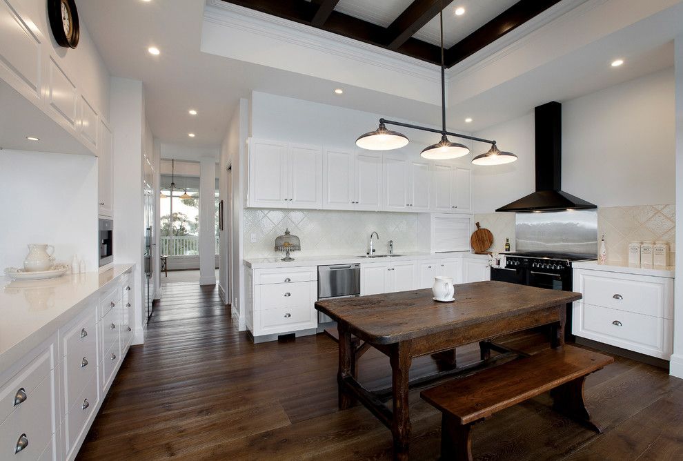 Cort Clearance Furniture for a Farmhouse Kitchen with a Dark Wood Ceiling Beams and Bowrings by Vibe Design Group