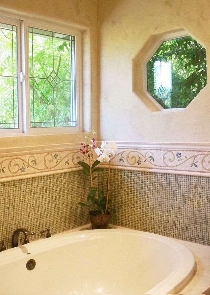 Cosa Marble for a Traditional Bathroom with a Limestone Bathroom and Ming Green Marble Master Bath Remodel by Plc Interiors