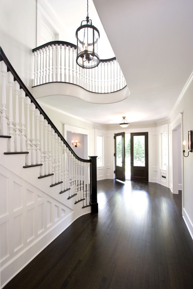 Cost to Refinish Hardwood Floors for a Traditional Entry with a Wooden Staircase and Award Winning Stair Hall and Entry Foyer by Clawson Architects, Llc