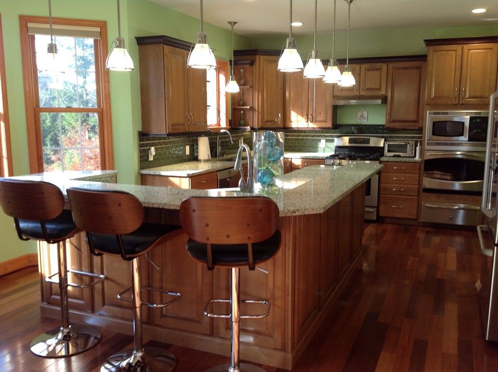 Costco Cabinets for a Eclectic Kitchen with a Wine Refrigerator and Vetrazzo Island by Avalon Kitchen