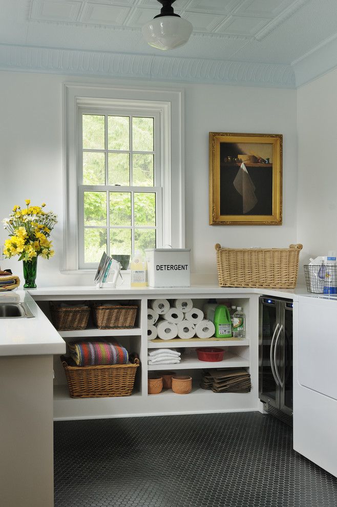 Costco Cabinets for a Traditional Laundry Room with a Stackable Washer and Dryer and New York Transformation by Crisp Architects