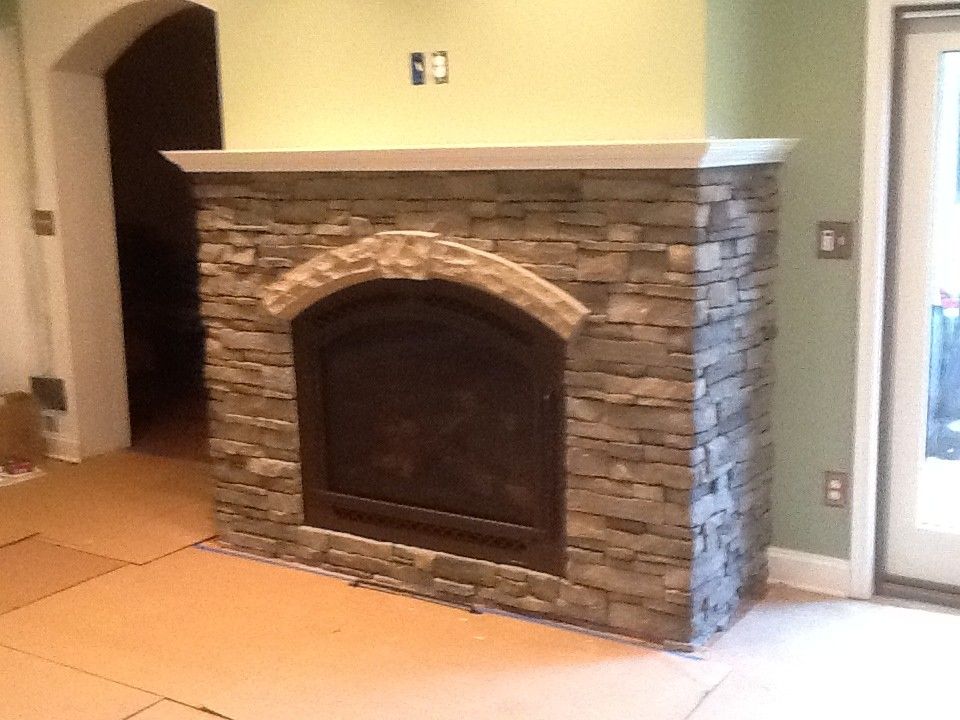 Courtland Hearth for a  Spaces with a Stone Work and Finished Installs by Courtland Hearth & Hardware