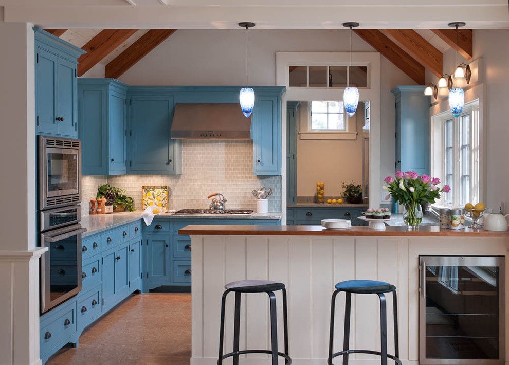 Crown Point Cabinetry for a Beach Style Kitchen with a Open Kitchen and Beautiful Blue Waterfront Cottage, Martha’S Vineyard by Elizabeth Swartz Interiors