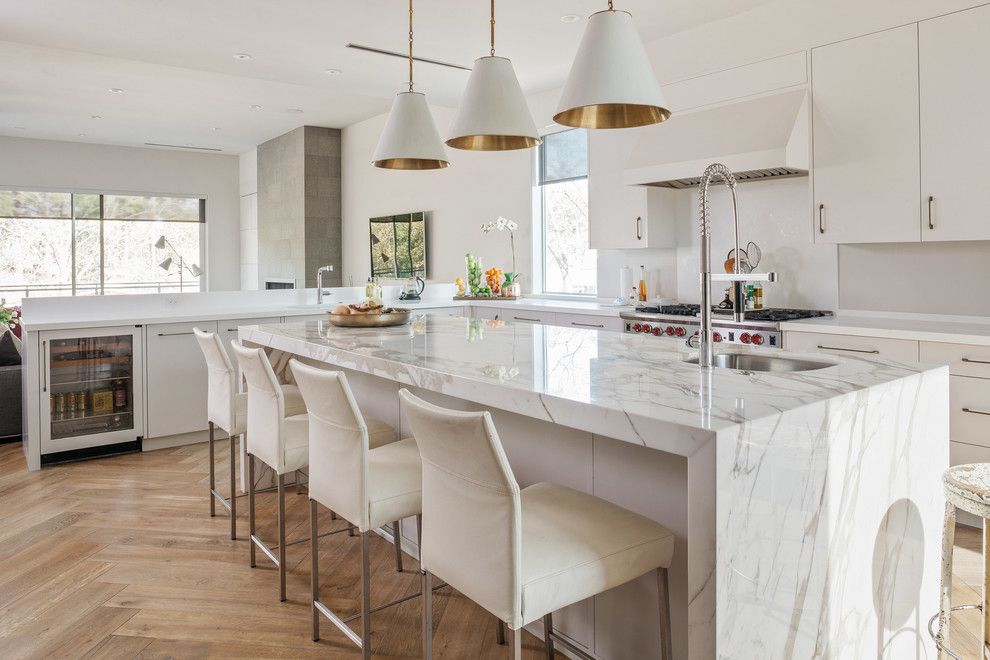 Csl Lighting for a Contemporary Kitchen with a Herringbone Wood Floor and Urban Modern by Poet Interiors