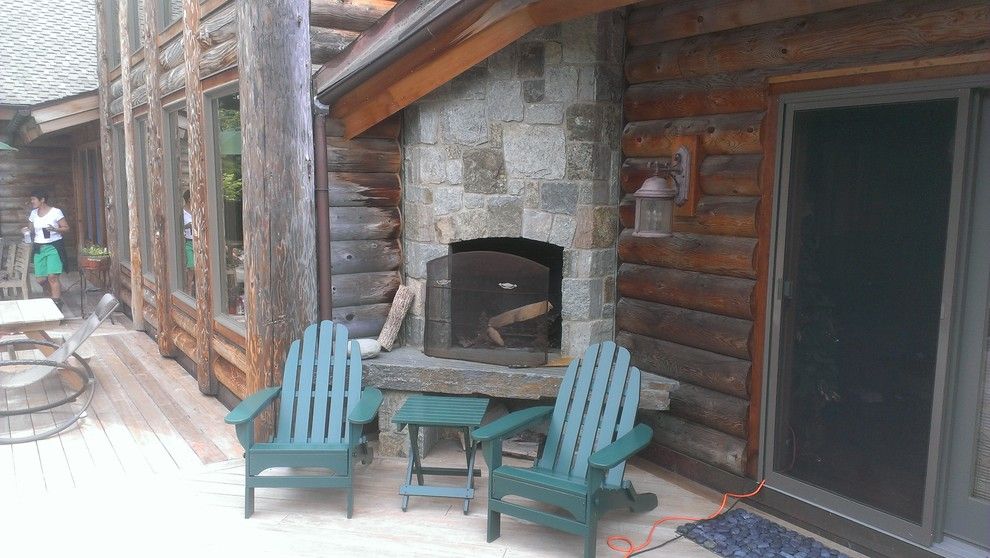 Cuddledown for a Rustic Deck with a Maine and Fireplace & Adirondack Chairs by Cuddledown