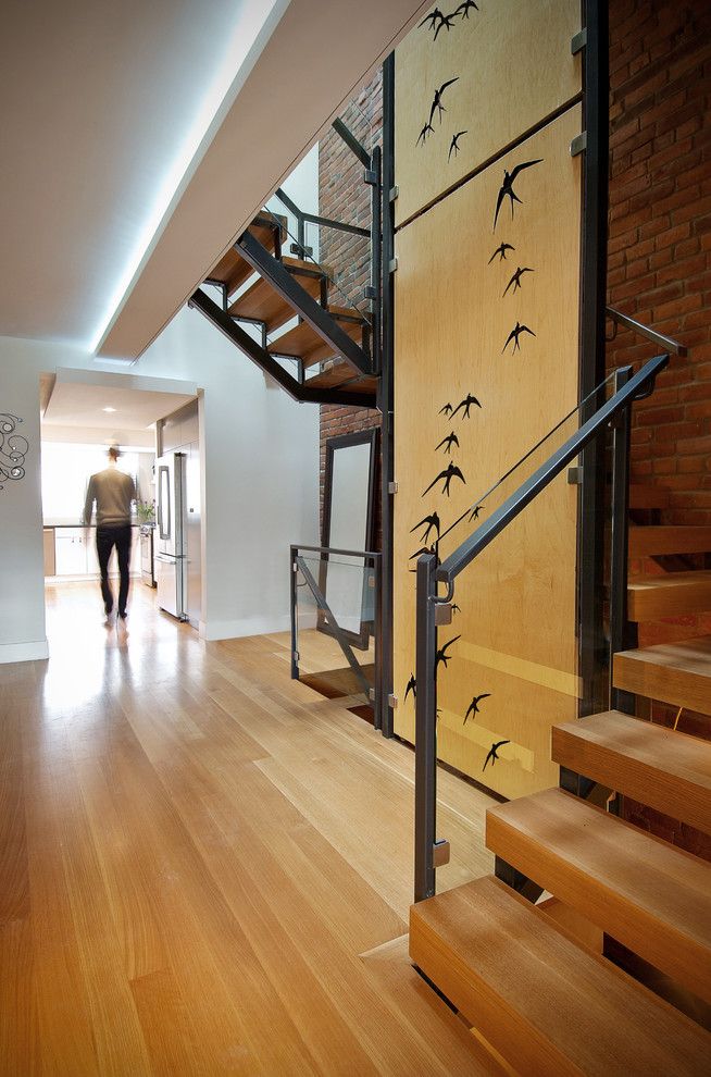 Cumtv for a Modern Staircase with a Open Risers and Oak + Steel Staircase by Roundabout Studio Inc.