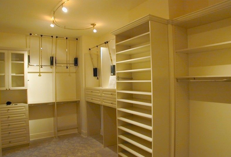 David Weekley Homes Houston for a Traditional Closet with a Dream Closet and Custom Closet Ideas and Features by Spaceman Home & Office