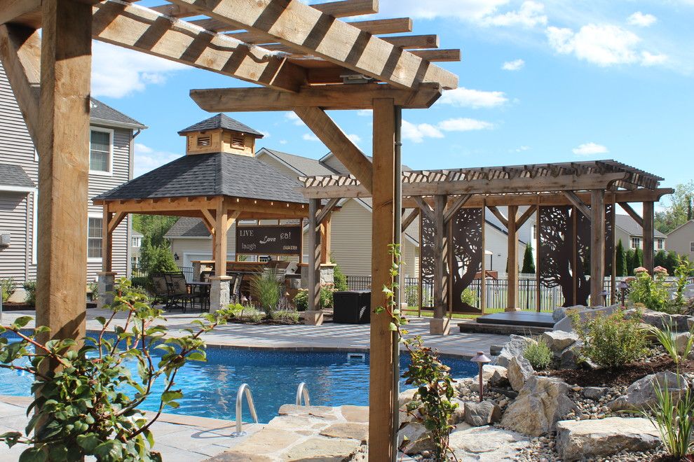 Delicatus White Granite for a Rustic Patio with a Hemlock and Outdoor Oasis by Flatbrook & Co