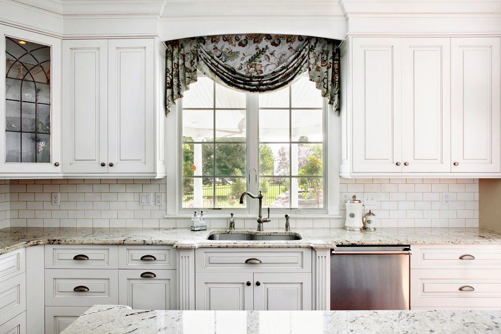 Delicatus White Granite for a Traditional Kitchen with a Exhaust Hood and Magnolia Way Kitchen by Sullivan Building & Design Group