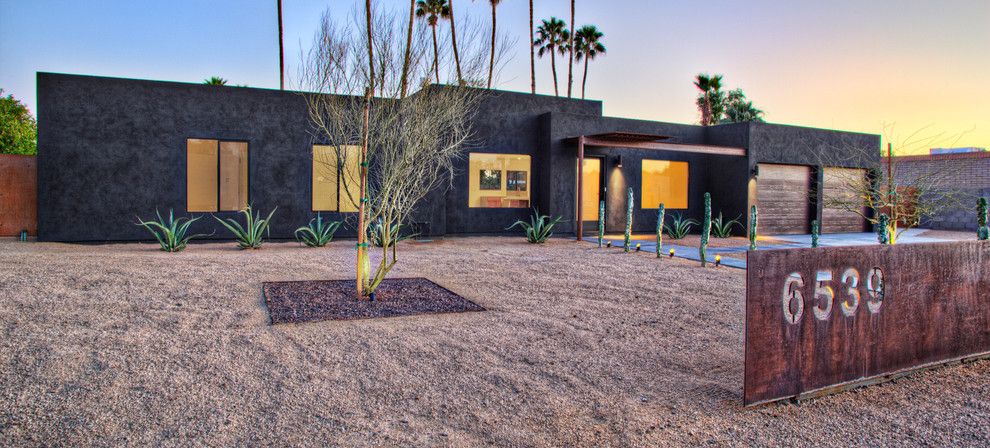 Desert Landscaping Ideas for a Southwestern Exterior with a Cacti and Black House (Steinman Renovation) by Spry Architecture