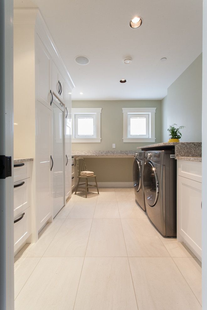 Desk Galore for a Transitional Laundry Room with a Long Room and Oceanfront Craftsman   Custom Home by Kenorah Design + Build Ltd.