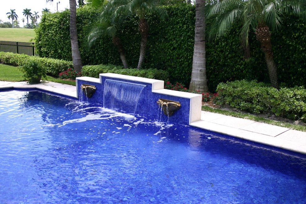 Diamond Brite for a Eclectic Pool with a Infinity Pool and Glass Tile Waterfall by Foreverpools