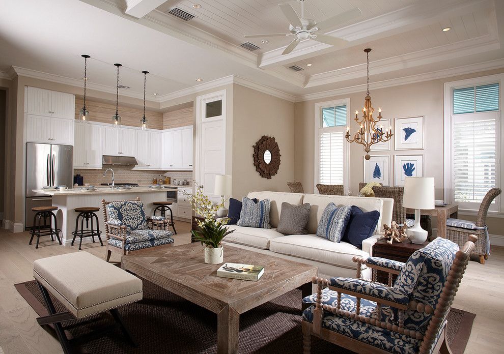 Distinctive Fabrics for a Beach Style Living Room with a Beaed Ceiling and Bent Palms by Kukk Architecture & Design P.a.