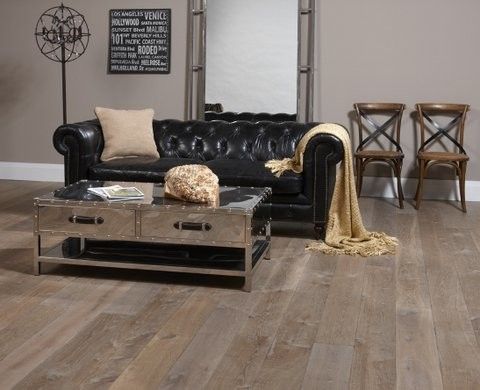 Distressing Wood for a Eclectic Living Room with a Tufted Black Sofa and Northern Wide Plank   Shades of Gray and Black by Michelle Finnamore Interiors Ltd.