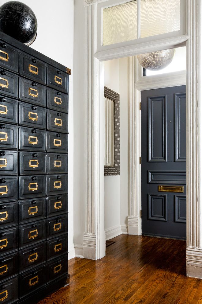 Doerr Furniture for a Victorian Entry with a Wood Floor and Victorian Home by Toronto Interior Design Group | Yanic Simard