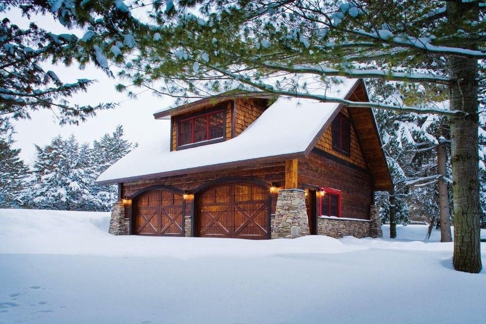 Dormers for a Rustic Garage with a Attic Storage and Carriage House   Lower Whitefish Lake 1   Winter by Lands End Development   Designers & Builders