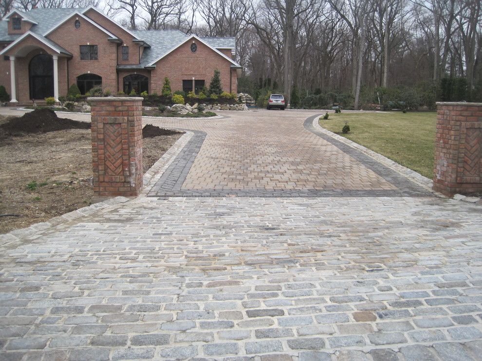 Driveway Apron for a Traditional Exterior with a Cobblestone Apron and Driveway Aprons by Legacy Brick & Stone