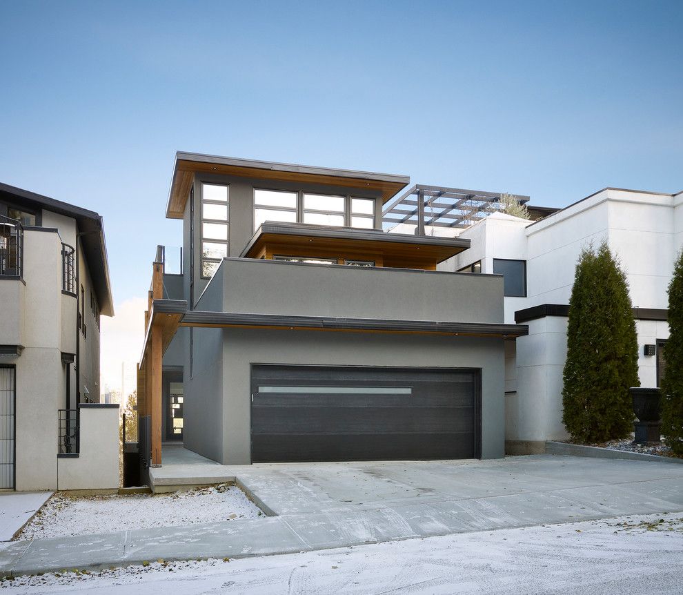 Dryvit for a Contemporary Exterior with a Garage and Paragon by Habitat Studio