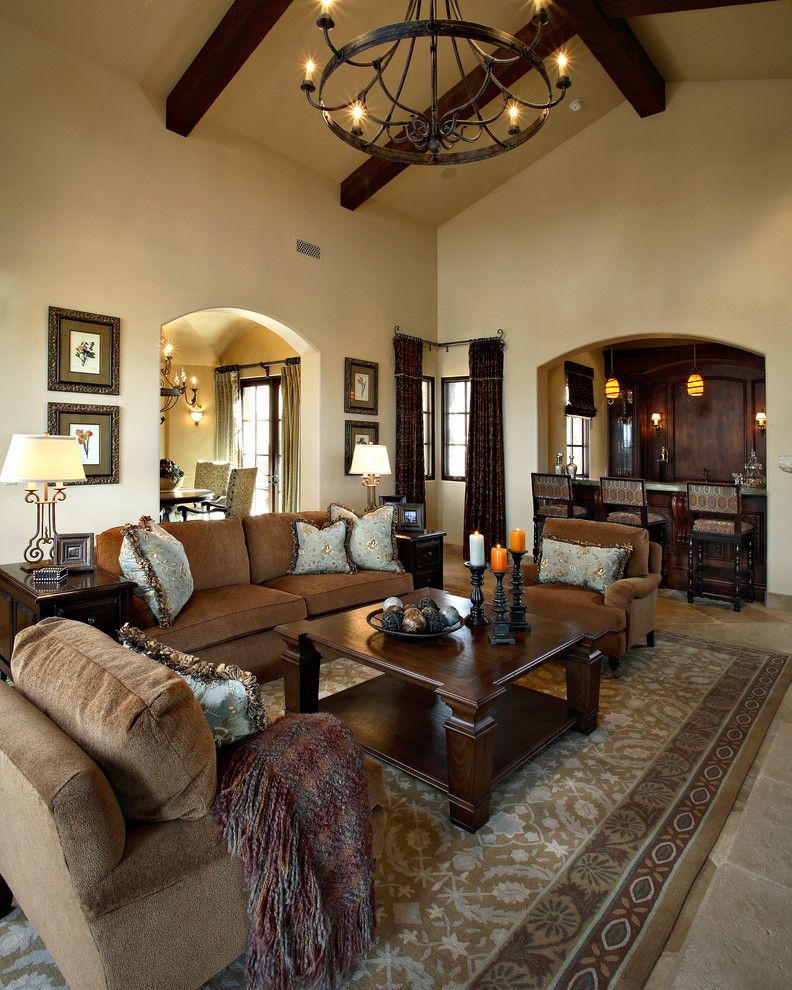 Dunn Edwards Swiss Coffee for a Mediterranean Living Room with a Brown Sofa and Superstition Mountain Traditional by Linda Seeger Interior Design