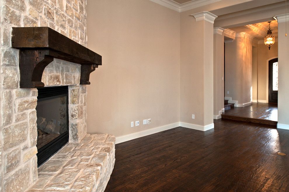 Duraseal Stain for a Traditional Family Room with a Cedar Mantel and Audubon by Joseph Paul Homes