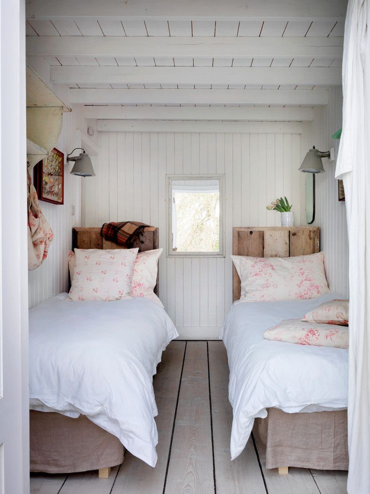 Duvet vs Comforter for a Beach Style Bedroom with a White Beams and Winchelsea Beach by Cabbages & Roses Ltd