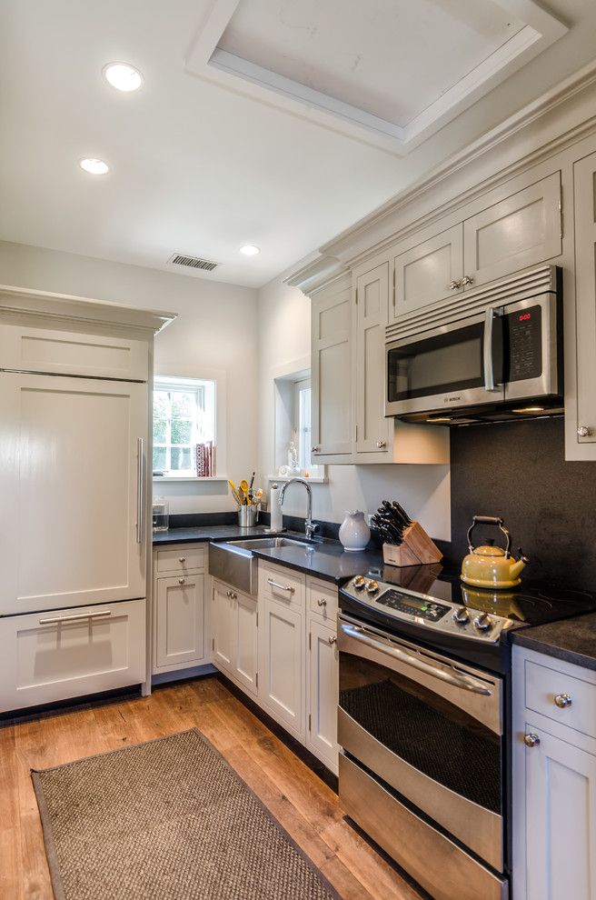 Edgecomb Gray for a Farmhouse Kitchen with a Galley Kitchen and Stone Cottage and Barn by Kelly and Co. Design