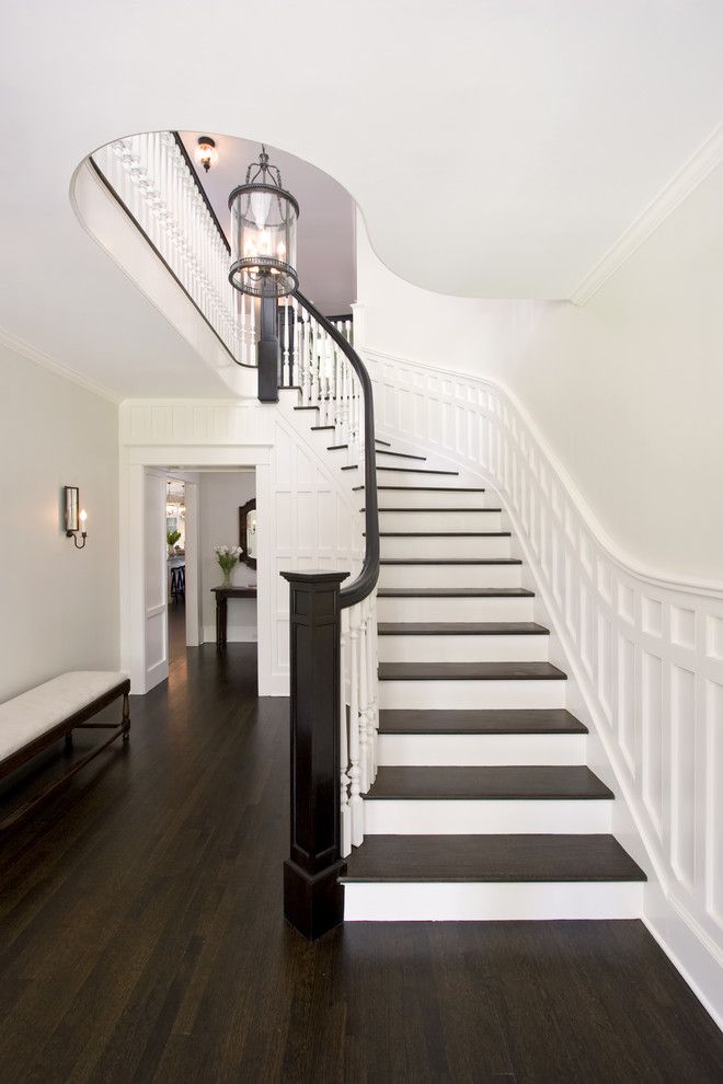 Eggshell vs Satin for a Traditional Staircase with a Wood Railing and Award Winning Curving Stair by Clawson Architects, Llc