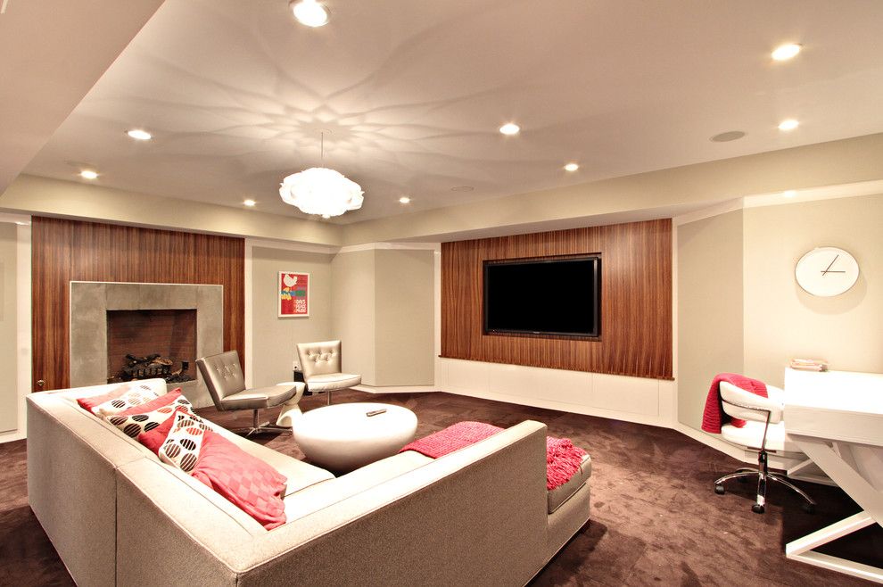 Elk River Theater for a Contemporary Basement with a White Clock and Random Work by D.a.s. Custom Builders