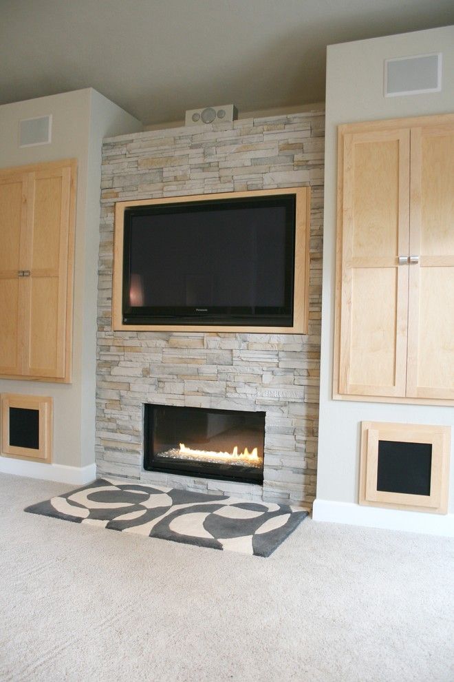 Elk River Theater for a Modern Living Room with a Gray and Living Room + Fireplace + Built in Cabinet Detail by Jordan Iverson Signature Homes