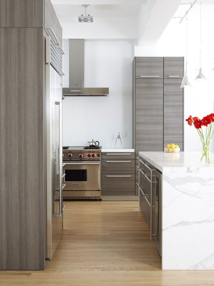 Engineered Hardwood vs Laminate for a Contemporary Kitchen with a Calacatta Marble Panels and Chelsea Loft by Chelsea Atelier Architect, Pc