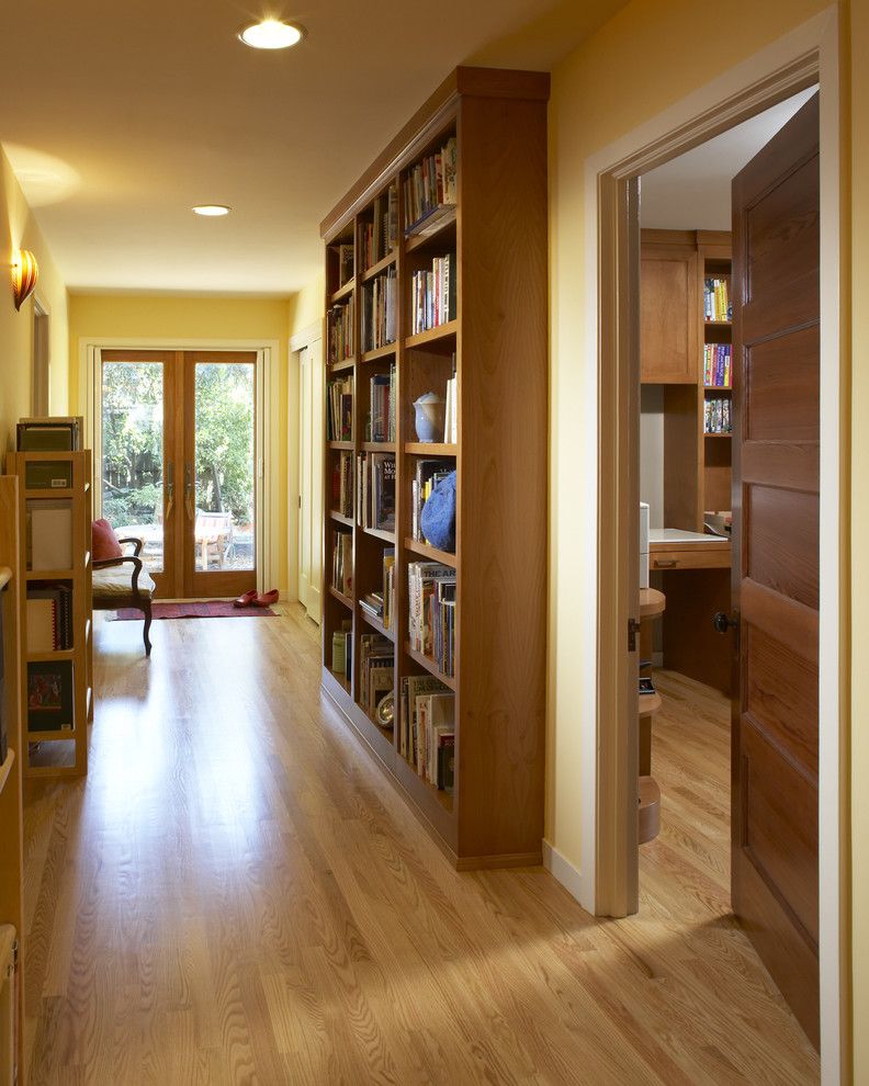 Engineered Hardwood vs Solid Hardwood for a Contemporary Hall with a Custom Shelves and Hall Library by Harrell Remodeling