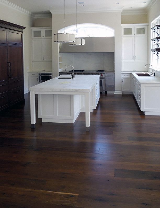 Engineered Hardwood vs Solid Hardwood for a Contemporary Kitchen with a Maple and Black Oak Floors by Signature Innovations Llc