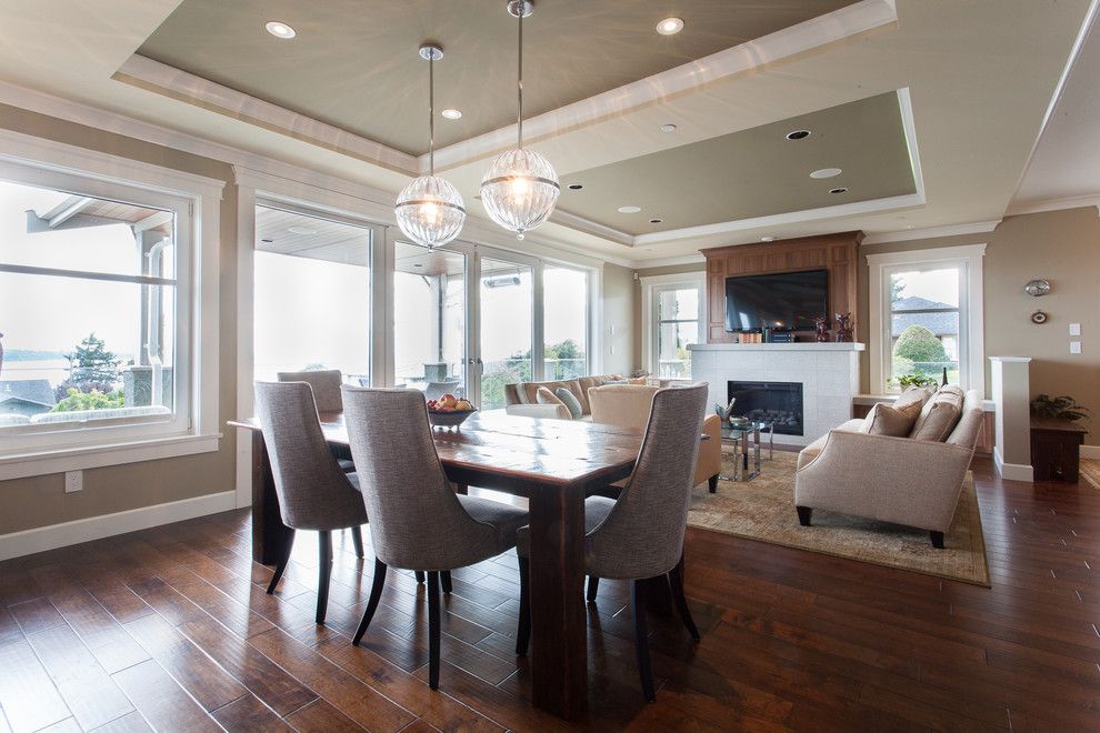 Engineered Hardwood vs Solid Hardwood for a Transitional Dining Room with a Area Rug and Oceanfront Craftsman   Custom Home by Kenorah Design + Build Ltd.