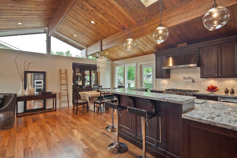 Engineered Hardwood vs Solid Hardwood for a Transitional Kitchen with a Console Table and Open Concept Kitchen with Vaulted Wood Ceiling by My House Design Build Team