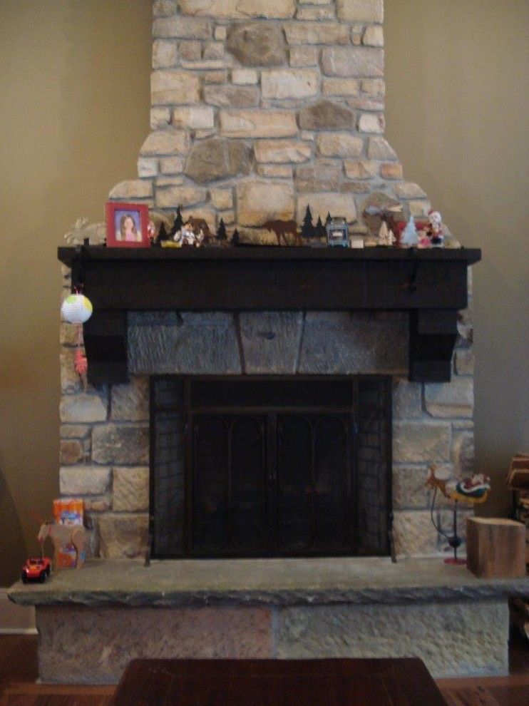 Exscape for a  Family Room with a Barn Stone Hearth and Fire Pits/places by Exscape Designs