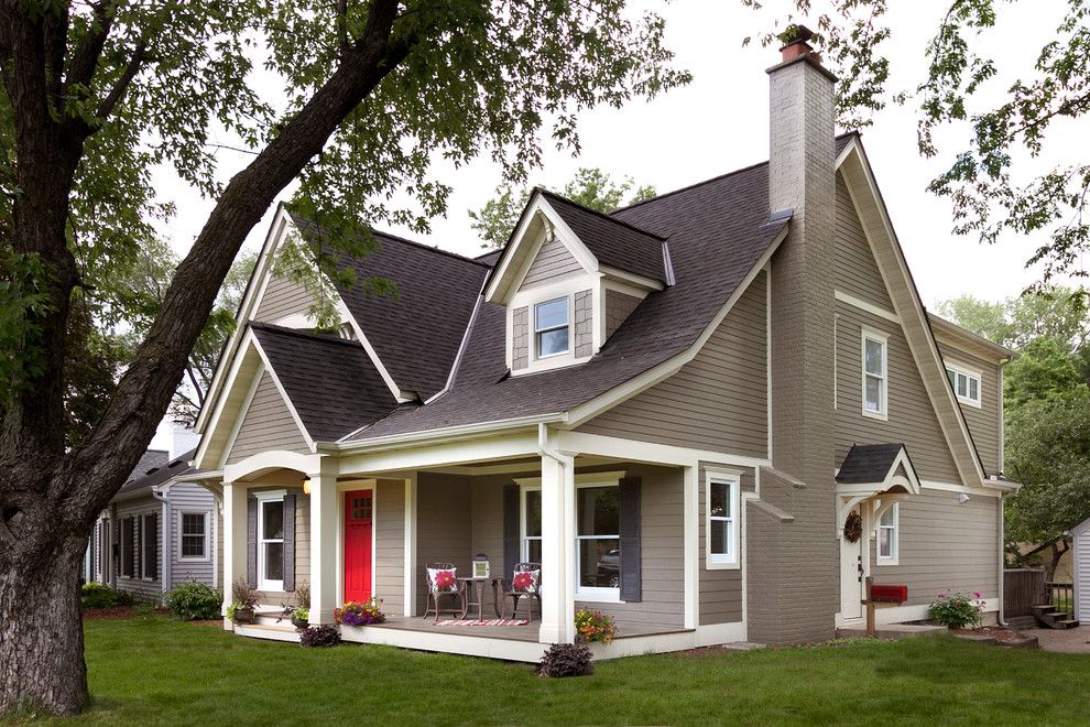 Exterior Color Schemes for a Traditional Exterior with a Red Front Door and Minikahda Vista Cape Cod by Fluidesign Studio