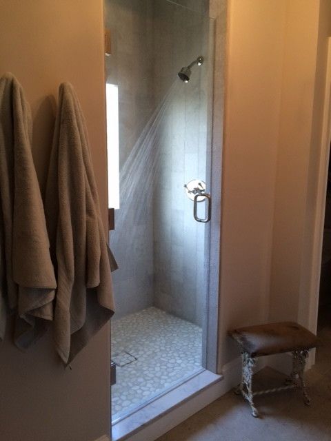 Fallingwater for a Transitional Bathroom with a Limestone and Mosaic Floor Textured Limestone Shower Walls and Ballantyne Country Club Master Bath Remodel by Fallingwater, Llc