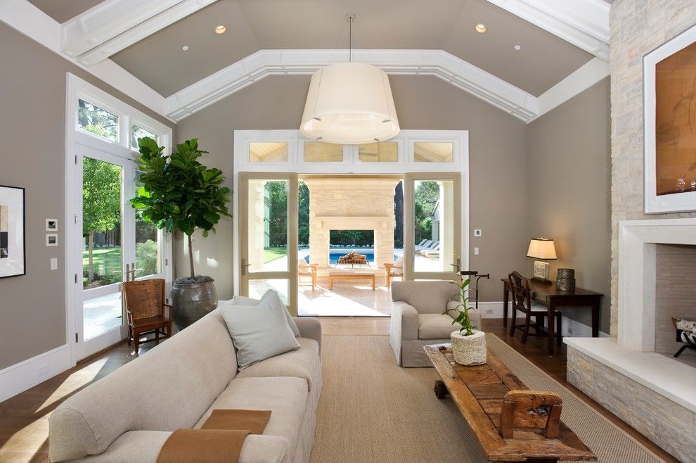 Feather River Doors for a Contemporary Family Room with a Dark Wood Desk and Almendral Project by Pacific Peninsula Group