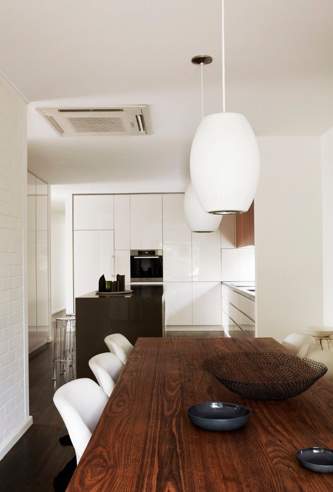 Feng Shui Bed Placement for a Midcentury Dining Room with a Pendant Lighting and Tracie Ellis' Home by Sharyn Cairns