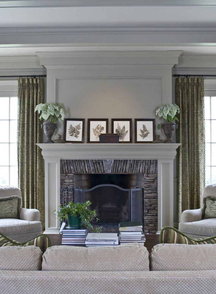 Fireplace Mantel Decorating Ideas for a Traditional Family Room with a S M and Traditional Family Room by Castrodesign.net